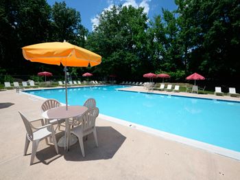 Poolside sundeck with relaxing chairs